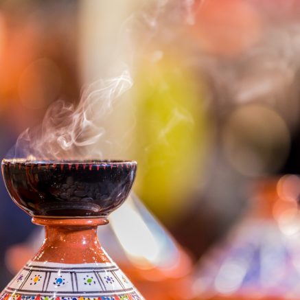 incense burning in ceramic dish